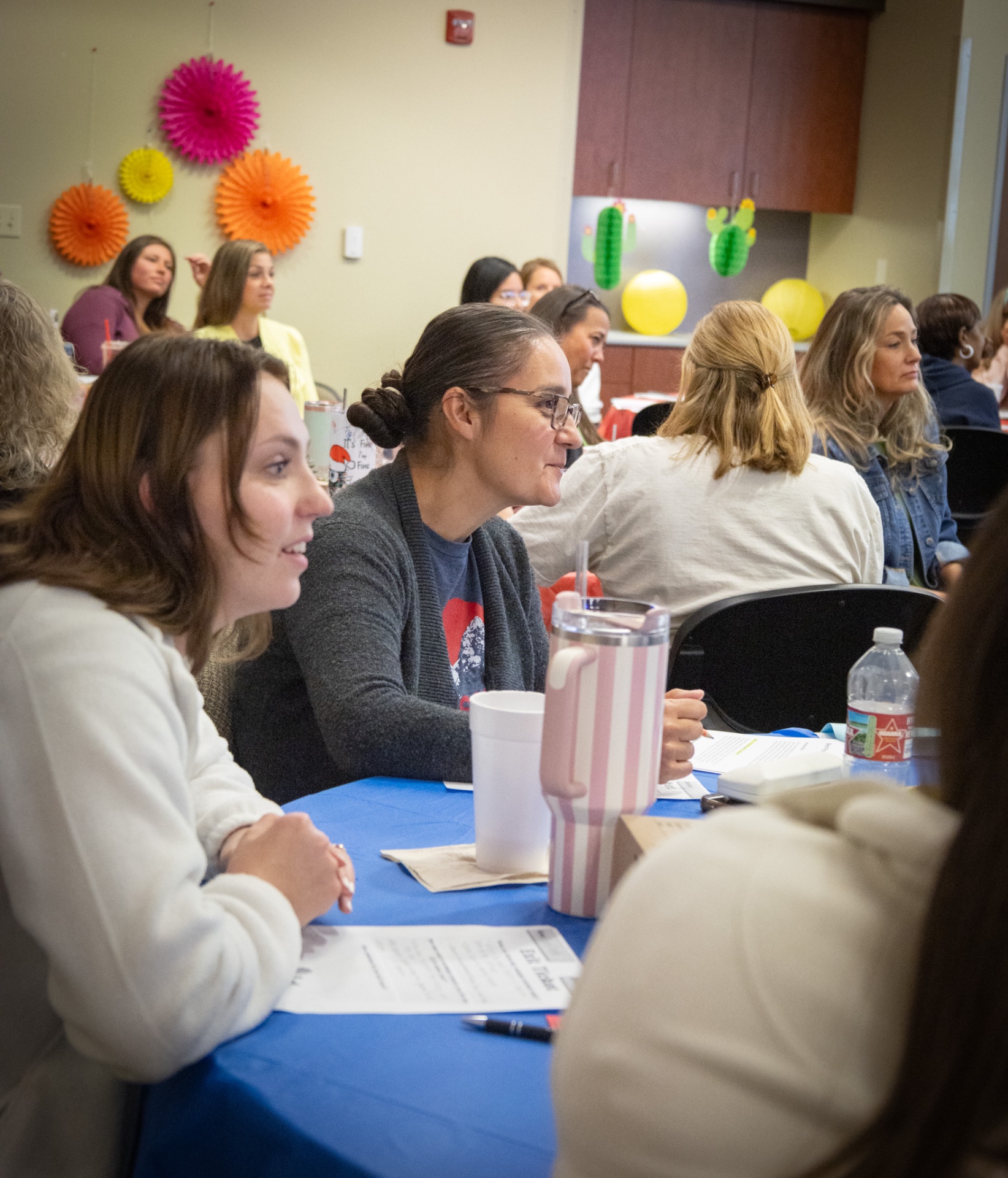 Engaged Head Start teachers smiling during Sally's session