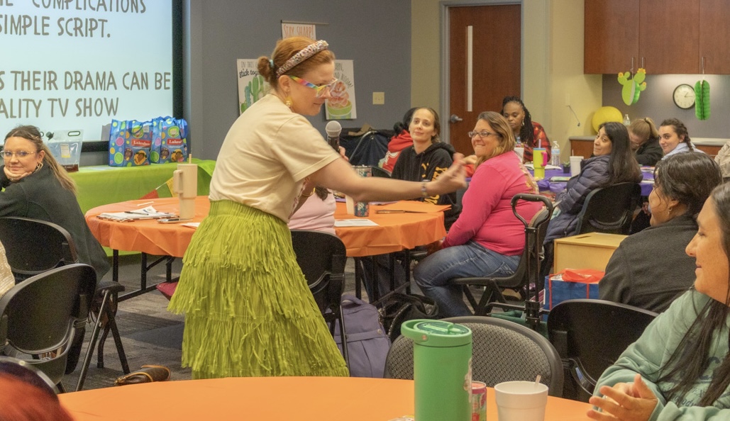 Sally leaning in and engaging directly with a Head Start teacher